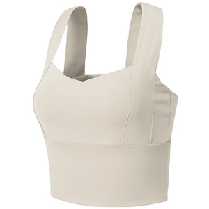 Women's cream sports bra with wide straps and high-stretch fabric for yoga fitness