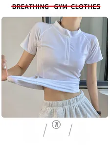 Close-up of white slim fit yoga top showing breathable stretch fabric and zipper detail