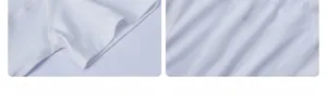 Detail of white sports top showing sleeve hem and breathable back mesh panel