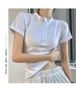 Detail of white half-zip sports T-shirt featuring stand collar and breathable quick-dry fabric