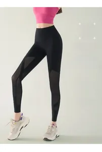 Detail of high waist yoga pants with breathable mesh panels and moisture wicking fabric