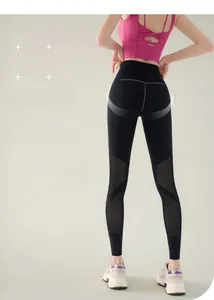 Detailed close-up of high waist yoga leggings with breathable mesh patchwork and lifting seams