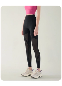 Detail view of high waist yoga leggings featuring mesh patchwork and breathable design