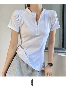 Close-up of white slim fit half-zip sports t-shirt with stand collar and raglan sleeves