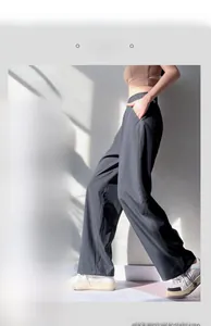 Detail of high waist yoga joggers with adjustable drawstring cuffs and side pockets