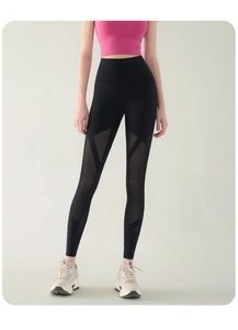 Close-up of high-waist yoga pants with mesh panels for breathability and leg shaping