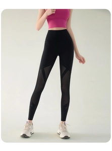 Detail view of high waisted black yoga leggings with breathable geometric mesh panels