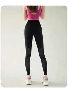 Detail of high waist yoga pants with breathable mesh paneling and butt lifting design