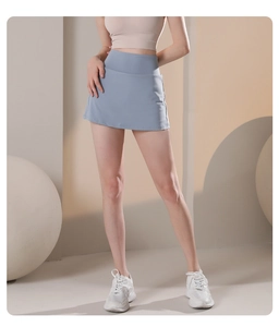 Detail of high-waisted light blue athletic skort featuring moisture-wicking fabric for tennis