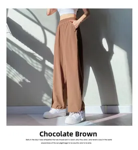 Detail view of high-waist chocolate brown sweatpants with adjustable drawstring hem