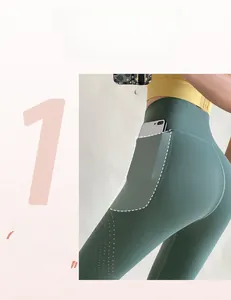 Detail of high waist yoga leggings with side phone pocket and breathable laser cut holes