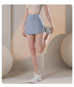 Detail of light blue high-waisted sports skort showing stretch and quick-dry fabric texture