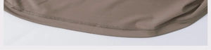 Detailed view of precision stitching and brown knit fabric on sports shorts