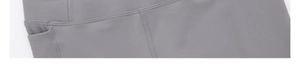 Close-up of dark grey yoga leggings featuring functional side pockets and flatlock seams