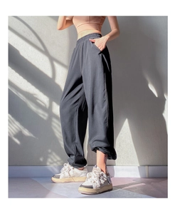 Detail of high waist black joggers with adjustable drawstring hem for sports and fitness