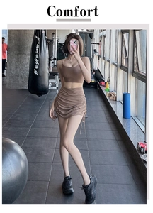 Detail view of brown yoga set featuring a side drawstring ruffled skirt and sports bra