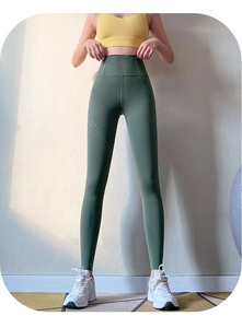 Detail view of high waisted yoga pants showing breathable laser-cut mesh wave pattern on side