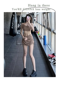 Detailed view of women gym set with brown drawstring mini skirt and sports bra