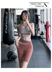 Detail view of pink and grey patchwork yoga set with high waist compression shorts