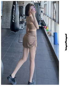 Close-up of mocha brown sports set with side drawstring yoga skirt and tank top detail