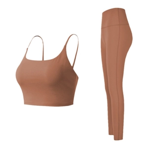 Detail view of quick-dry yoga set in caramel color featuring sports bra and high-waist leggings