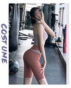 Detail view of high-waist fitness leggings with breathable mesh patchwork and stitching