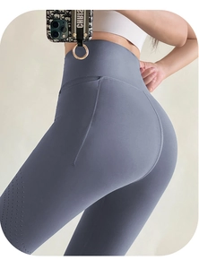 Detail of high-waist yoga leggings featuring laser-cut breathable mesh and slimming seams