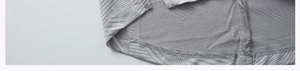 Détail macro du tissu de sport gris avec texture géométrique et maille respirante