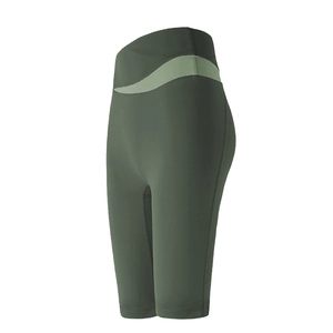 Olive green high-waisted yoga shorts with light green side panels and elastic matte fabric