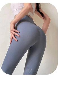 Detail of high waisted yoga leggings featuring breathable laser-cut mesh on the side