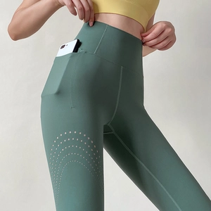High-waisted dark green yoga leggings with mesh side pockets and breathable laser-cut holes
