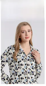 Detail of elegant silk printed blouse featuring a classic lapel and zipper closure design