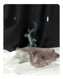 Detail shot showing steam passing through lace panties to demonstrate high breathability