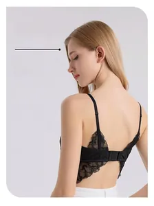 Macro shot of elegant black lace back design with adjustable straps on silk bra