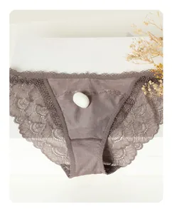 Detail view of lace panties featuring 100% mulberry silk crotch and delicate floral edges