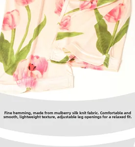 Détail de l'ourlet du pyjama en soie avec imprimé tulipe et couture surjetée fine