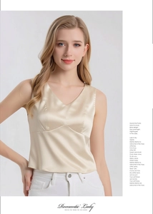 Detail of silk satin V-neck camisole in champagne gold with elegant texture and pearl luster