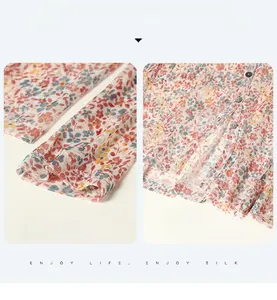Detail view of floral silk sun protection top featuring neat cuffs and buttoned hemline