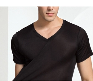 Detailed close-up of premium black silk knit fabric on a V-neck T-shirt for men