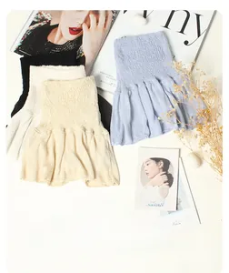 Detail showing elastic knitted silk collars in black, apricot and light blue colors
