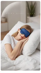 Deep blue silk sleep mask on model, showing light-blocking fit for high-quality rest