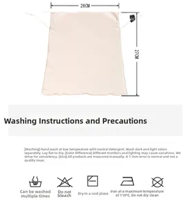 Detail of pink mulberry silk drawstring storage bag with 26x27cm size markings and care icons