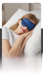 Detail of soft navy blue silk sleep mask on model, showcasing light blocking and comfort
