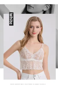 Detailed view of intricate white floral lace mesh on a silk camisole with scalloped hem