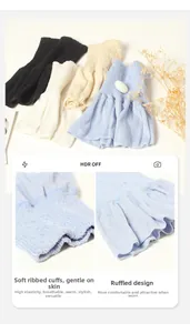 Detailed view of elastic ribbed knit cuffs with decorative ruffle hem in four colors