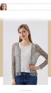 Detailed close-up of semi-transparent floral silk fabric on women's long sleeve sun protection cardigan