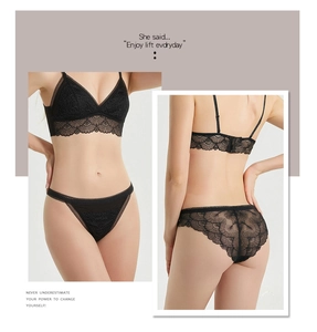 Detailed close-up of premium black floral lace lingerie set with silk gusset and sheer finish
