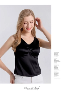 Detail of elegant black silk V-neck tank top with ruched bust and satin finish