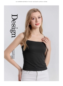 Detail of a slim black mulberry silk camisole with thin straps and a soft satin finish