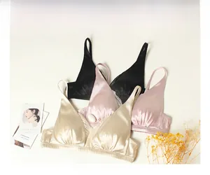 Three silk lace bras in black, pink and gold with elegant triangle cups and smooth finish
